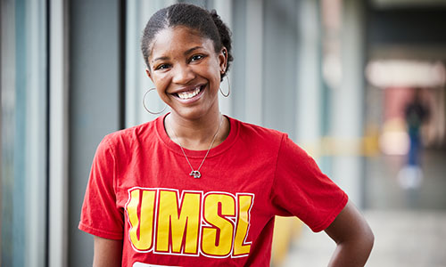 student in red UMSL shirt