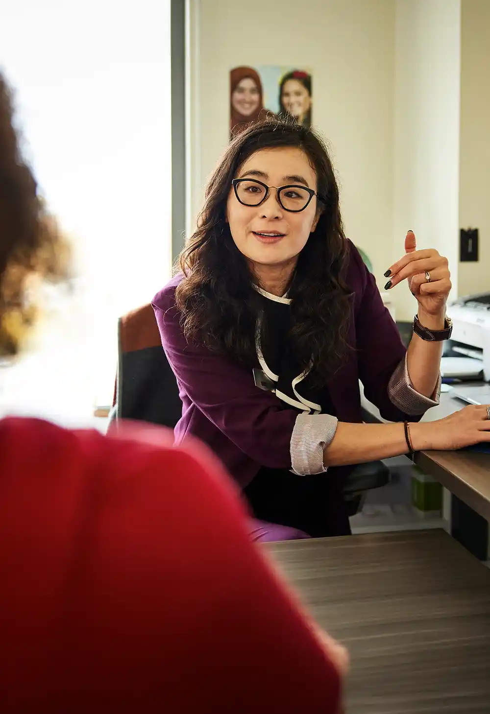 Portrait of advisor and student at a desk
