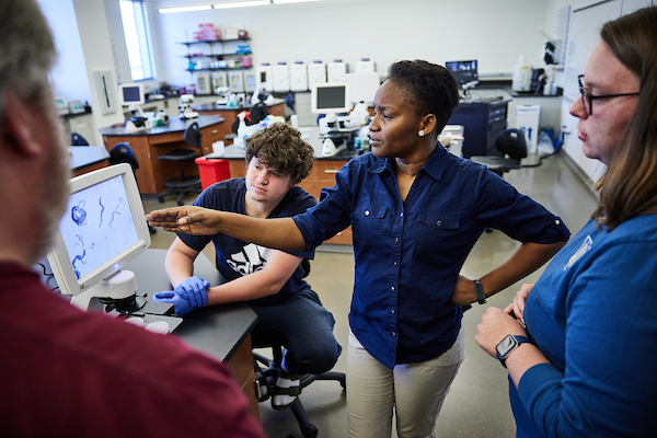 Professor speaking with students