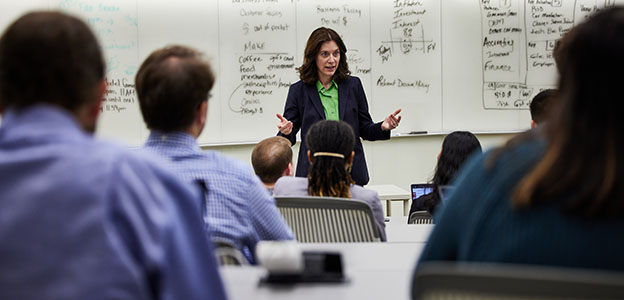 students in a classroom with a professor