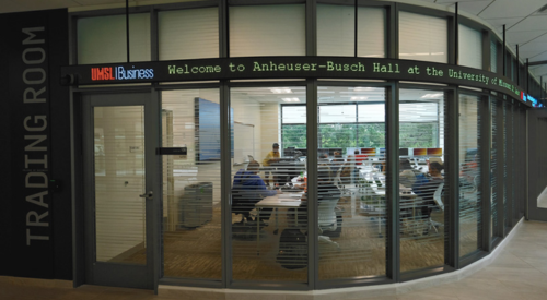 a picture of a classroom with large windows to look through with a finance ticker