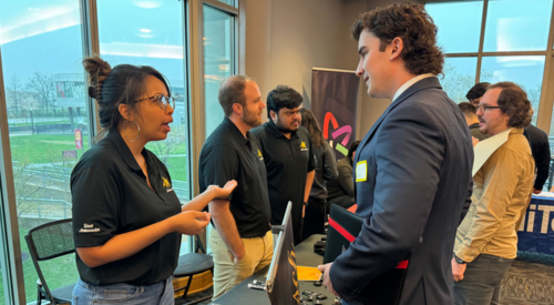 people talking at a conference