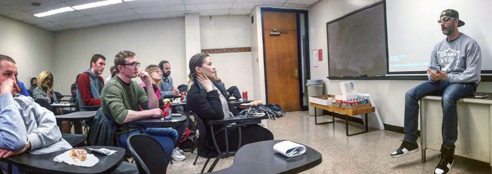 Jason Bockman presents during a Marketing club meeting