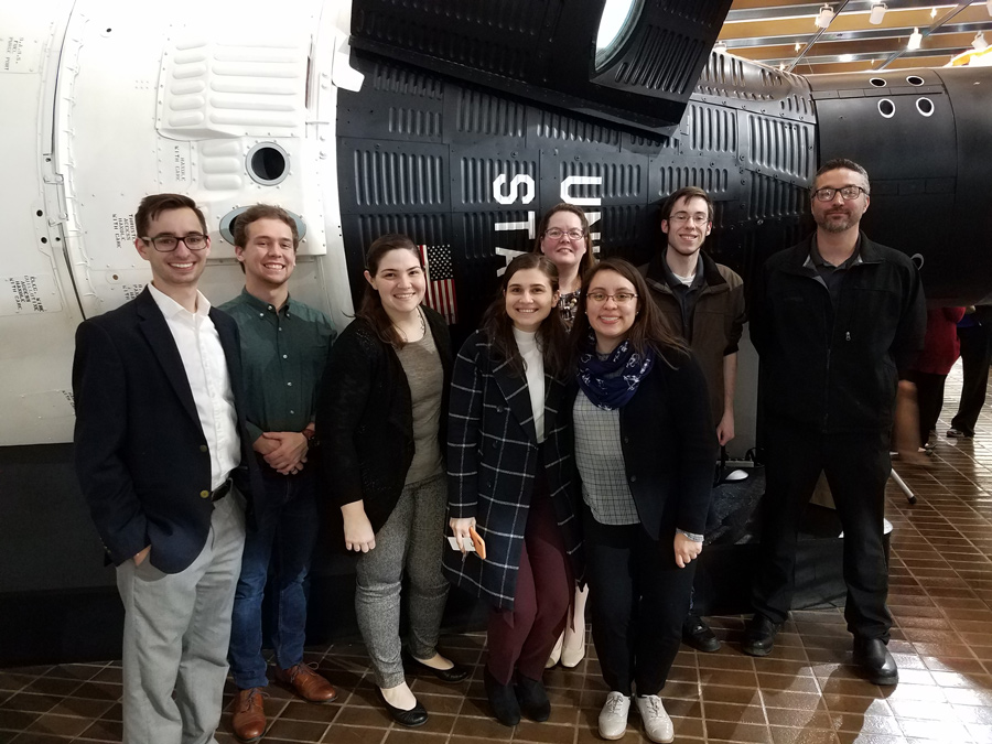 UMSL Supply Chain & Transportation Club officers in front of the Gemini spacecraft at Boeing’s James S. McDonnell Prologue Room. 