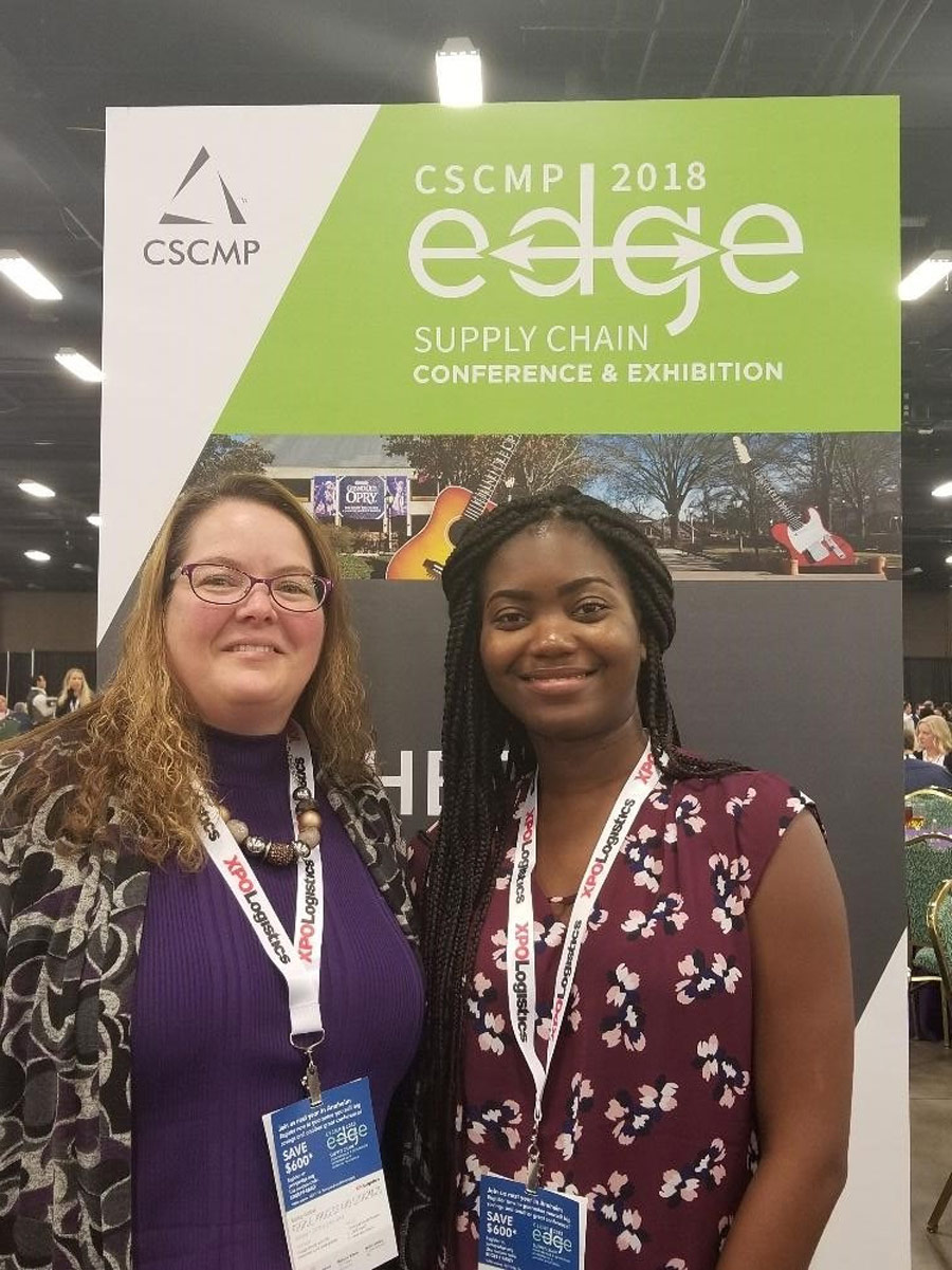 UMSL Supply Chain and Transportation Club officers Jennifer Downey and Helene Bassimana