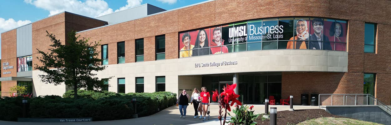 UMSL students walking away from Anheiser Busch Hall, home of the Ed G. Smith College of Business