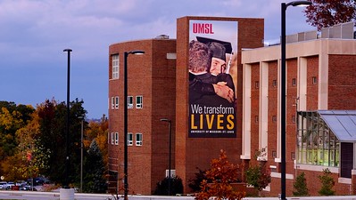 view of a campus building with a large banner