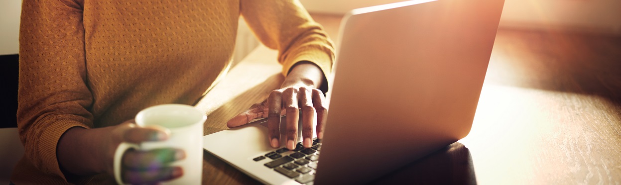 person sitting at a laptop