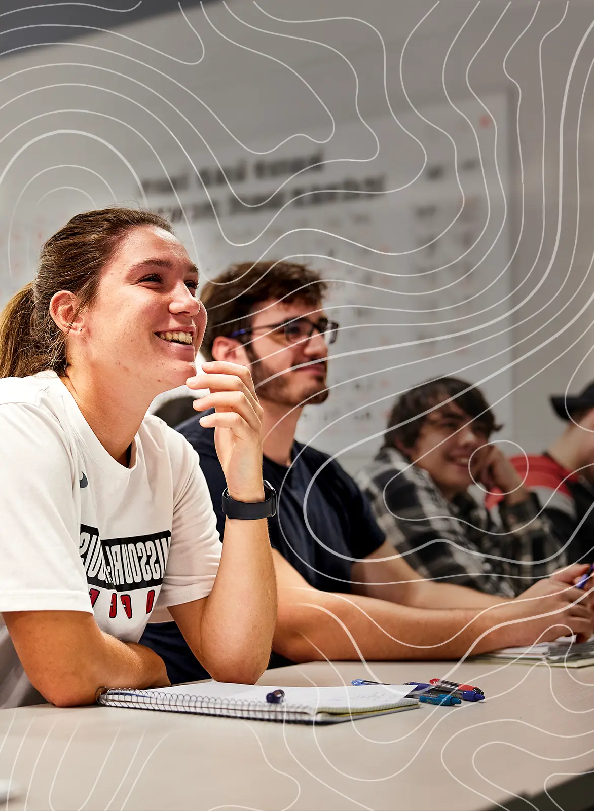two UMSL students and a faculty member examine a plant