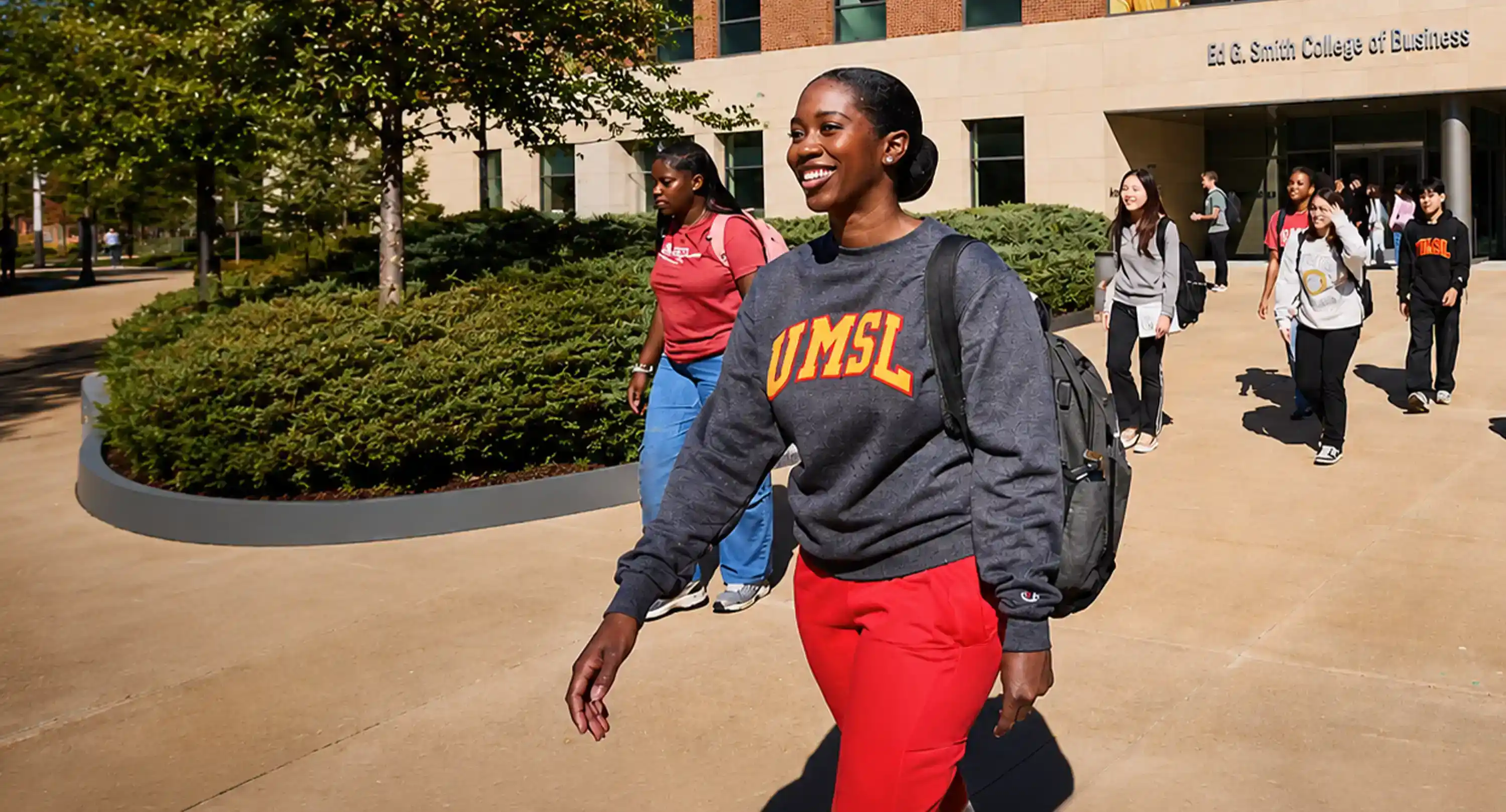 UMSL students walking along a pathway