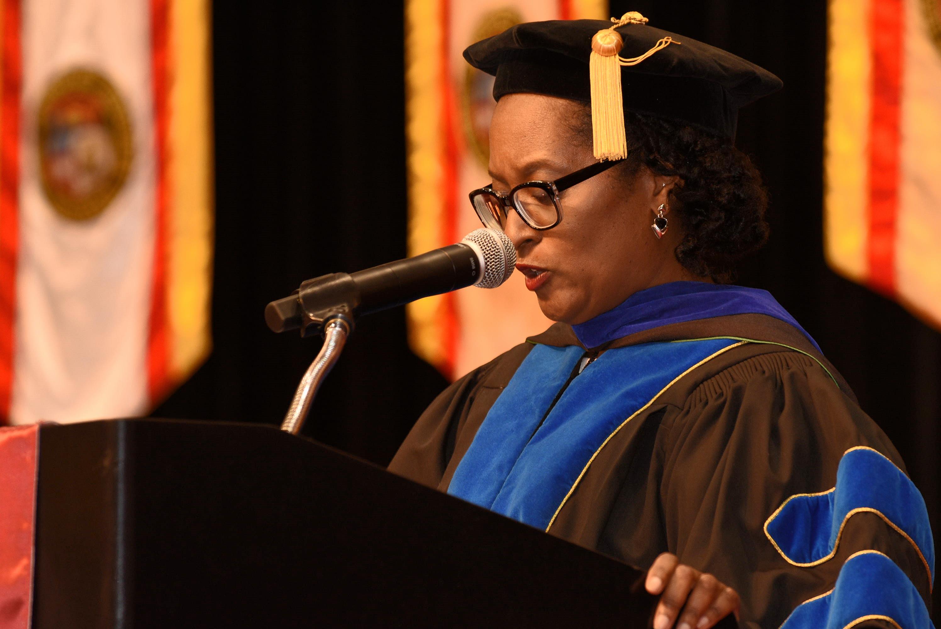 Faculty member speaking at Commencement