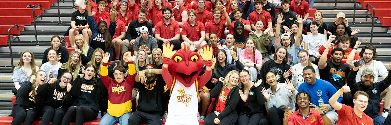 group of studens and Louie at Pack the Stands