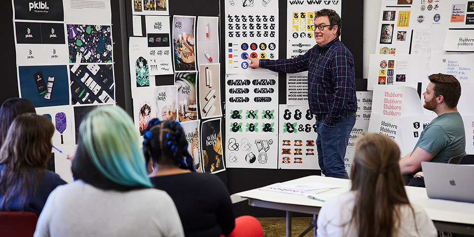 faculty and students in a design class