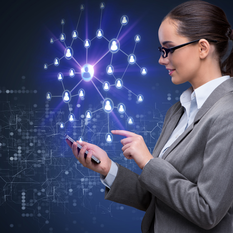 A businesswoman in a suit interacts with a smartphone while visualizing a network of connected users.