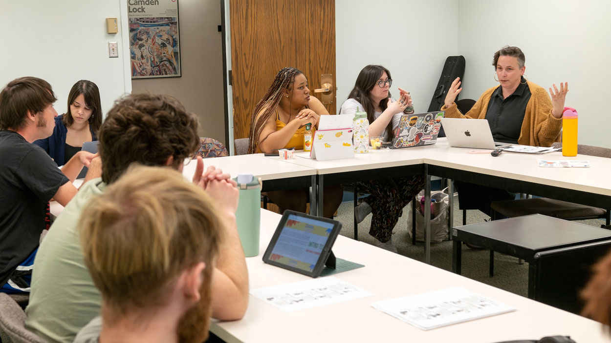 Dr. Lauren Obermark runs an intense discussion with her students