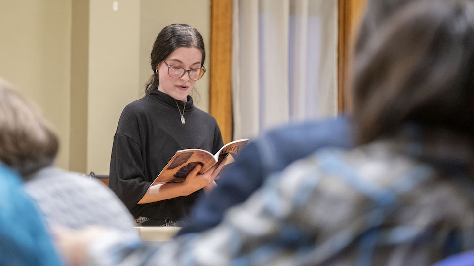 A student reading a poem