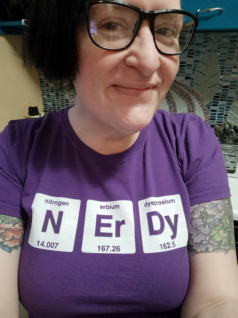 selfie of Amy wearing shirt of biological elements that spells out Nerdy