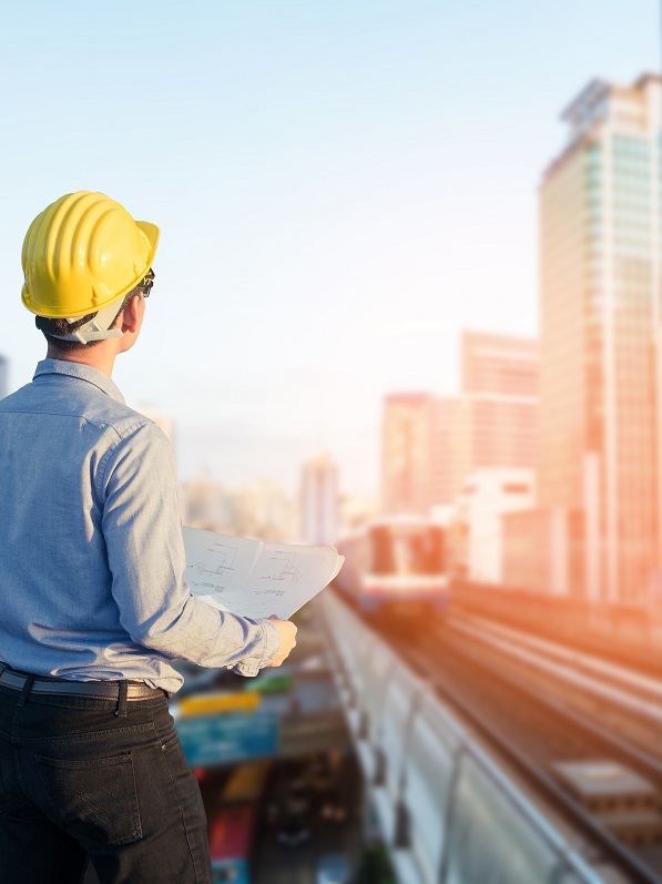 engineer looking at a tall building