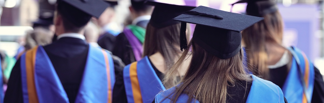 graduates in commencement dress