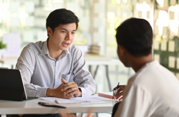 two people in an interview for a job