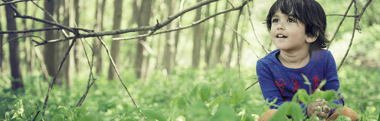 young child in the forest