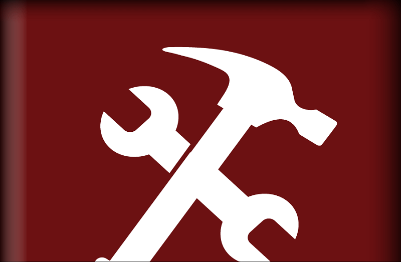 hammer and wrench crossed on a red background