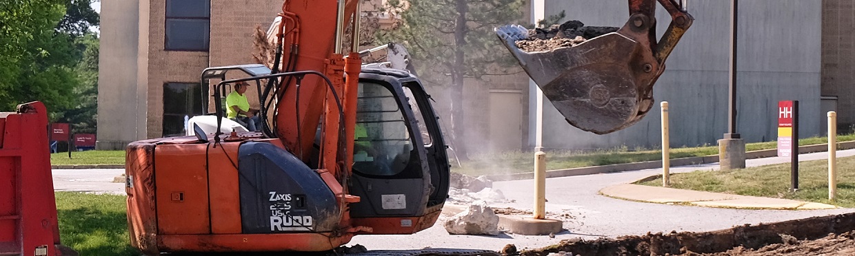 employee working a backhoe