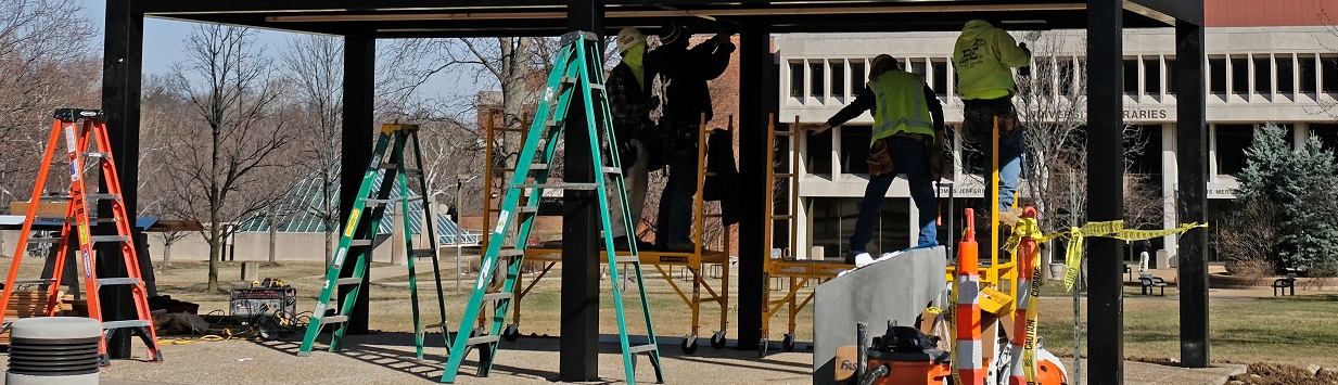 workers at a construction site on campus