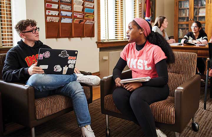 Two honors college students engaged in conversation