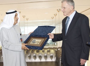 Two men passing a ceremonial gift