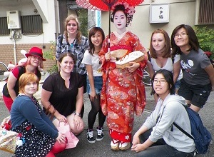 Group of students surrounding a Geisha