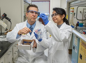 Professor and student in a science lab