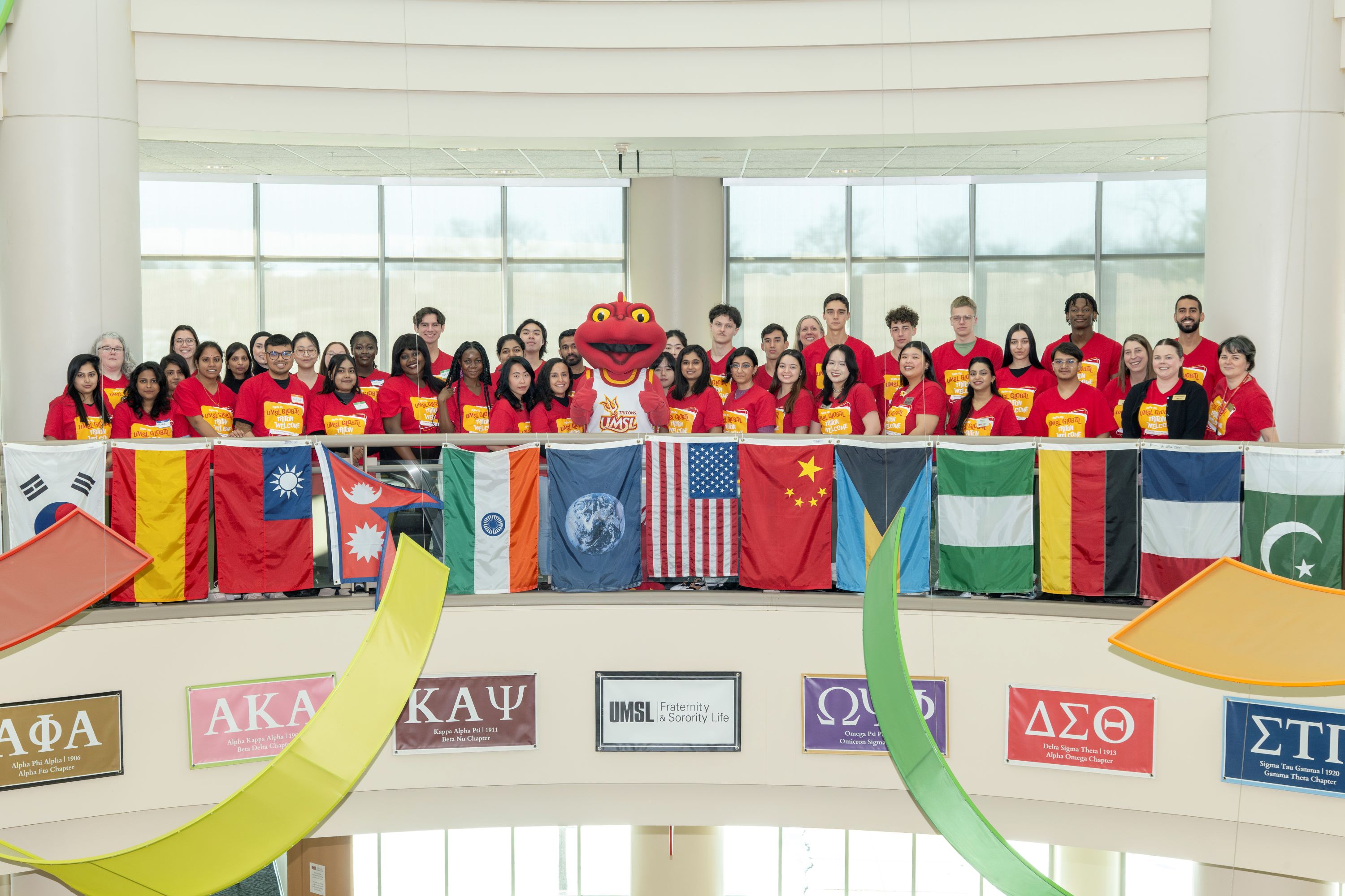 Global Triton Welcome Group Photo with Louie by Flags