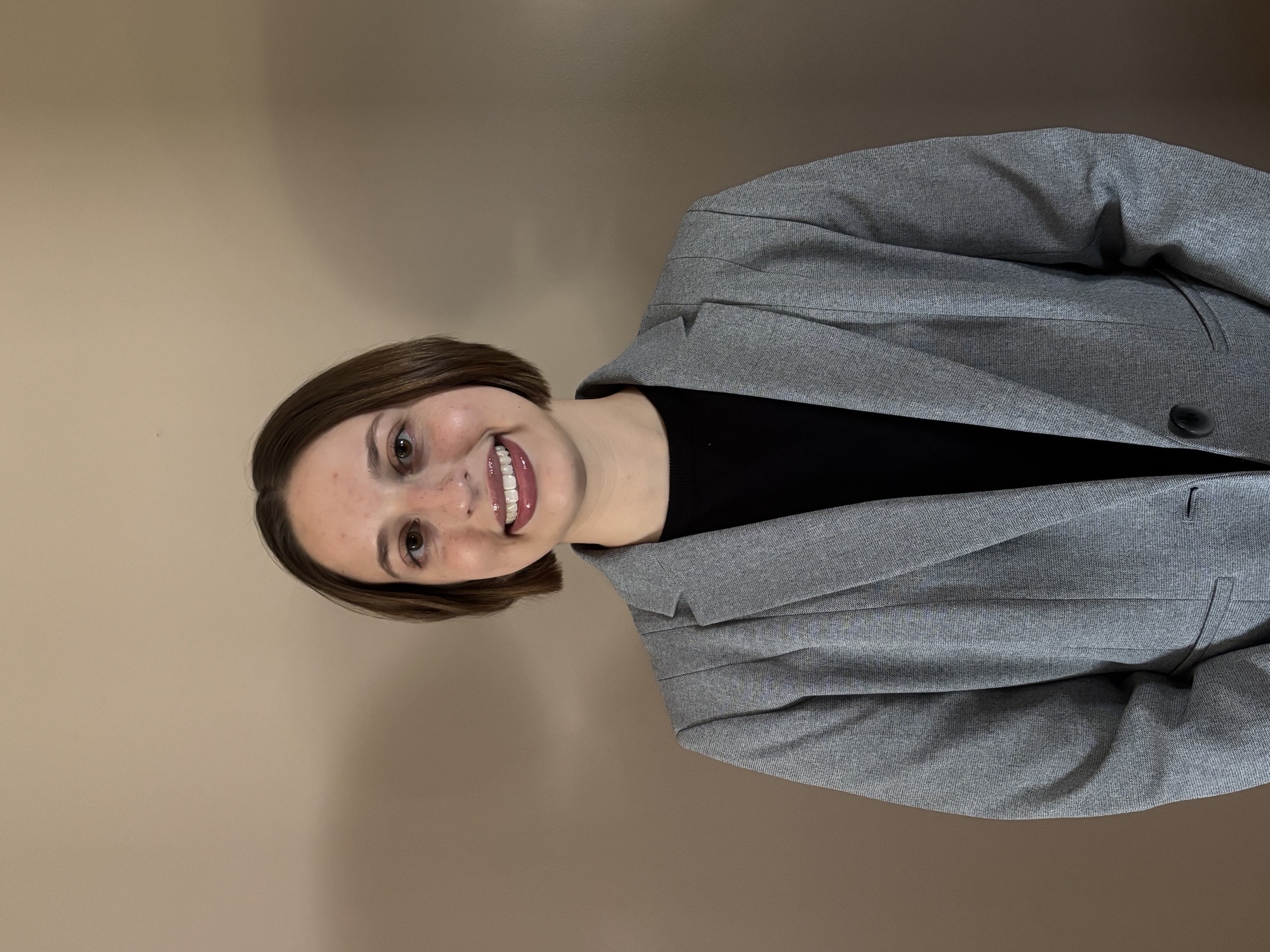 Placeholder graphic with three spotlights on a dark background and the text “PHOTO COMING SOON” in large white letters.