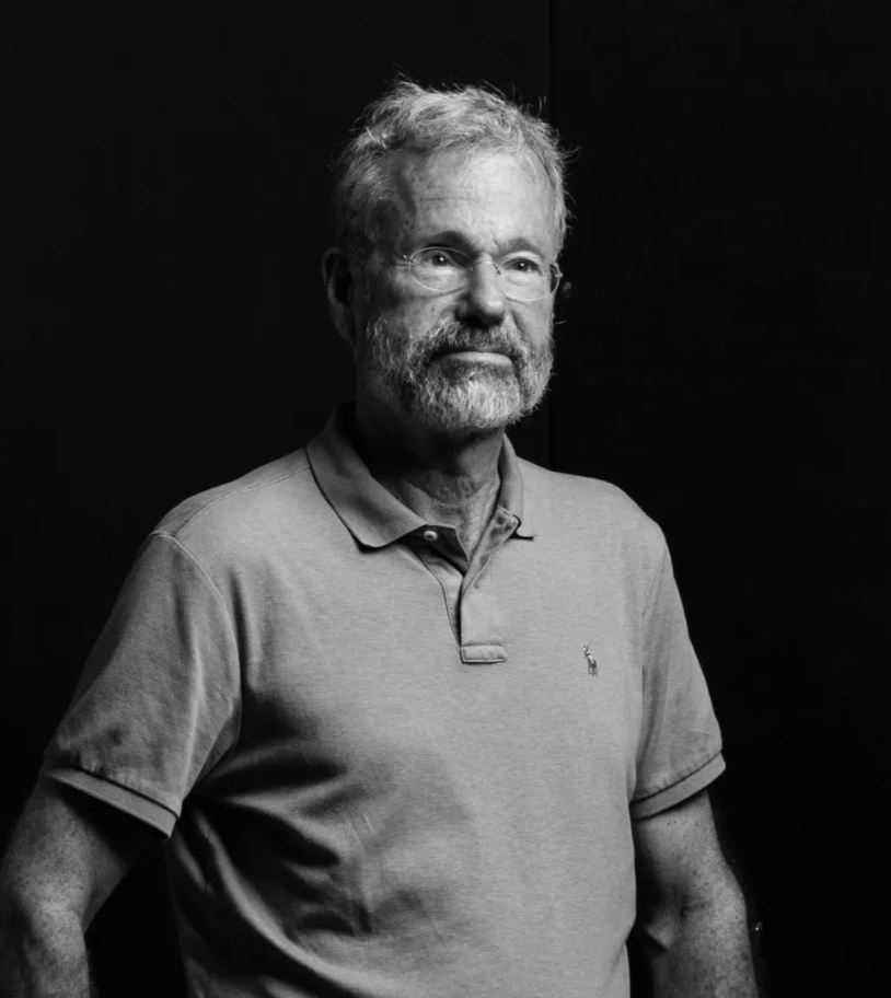 Man standing in a dark room