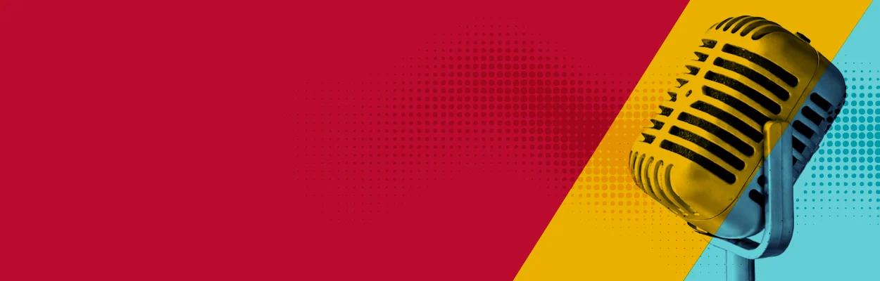 Vintage microphone against a vibrant red and turquoise background.