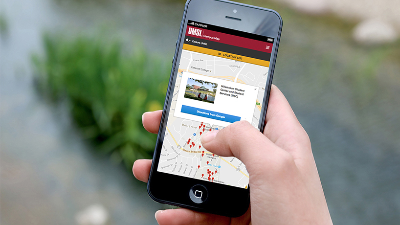 Hand holding an iphone displaying campus map application