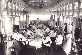 (Image: Men sitting around a table on the Steamer Erastus Wells)