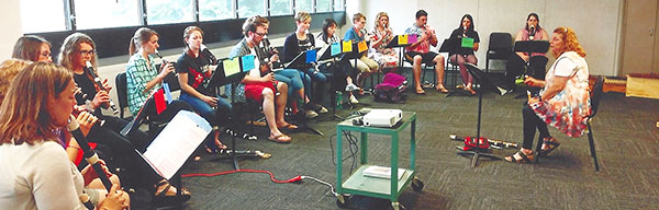 students playing recorders