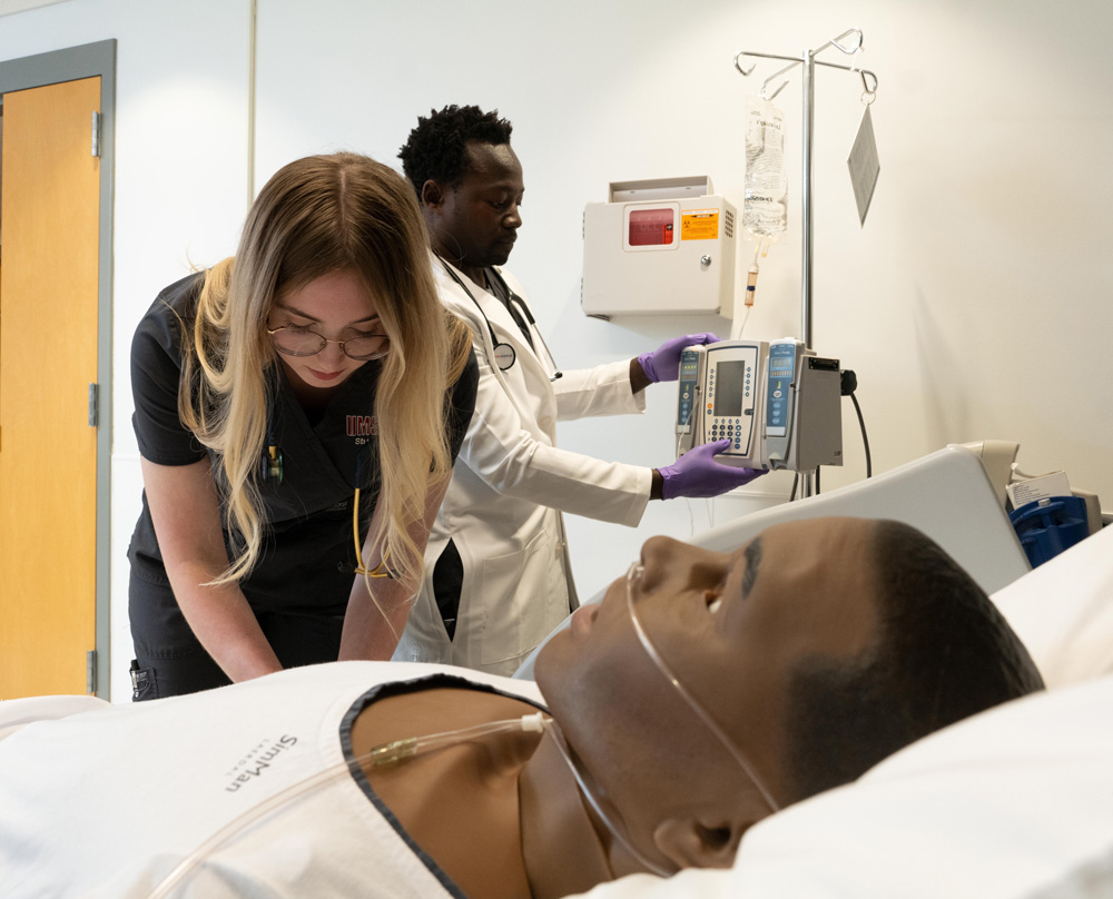 nursing student with adult simulation patient