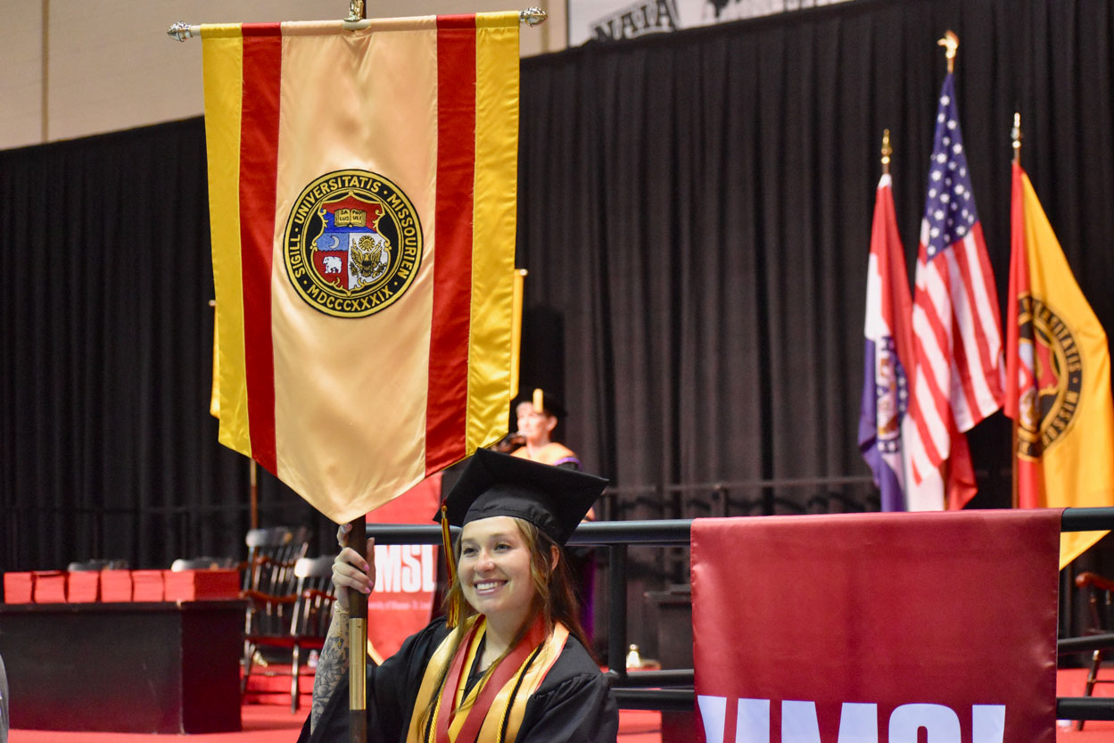 BSN graduate Ashley Borowitz earning Summa Cum Laude at UMSL's Commencement on May 16