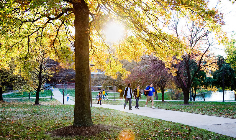 students walking on campus in fall