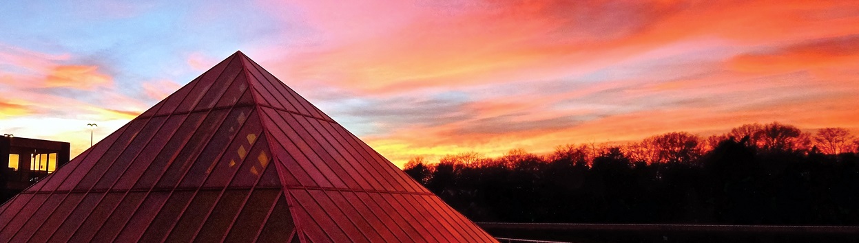 sunset behind the pyramid