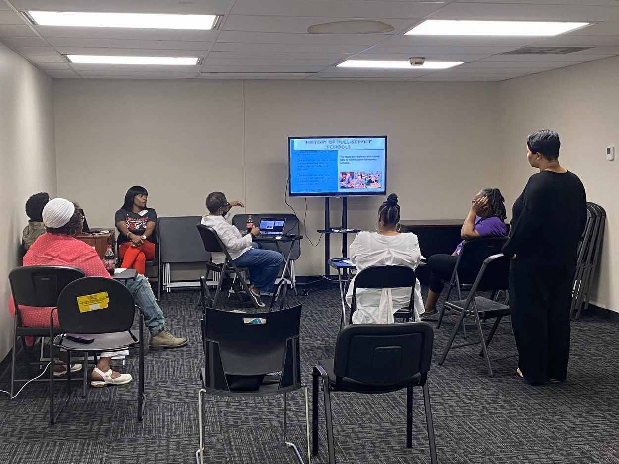 people sitting around a tv