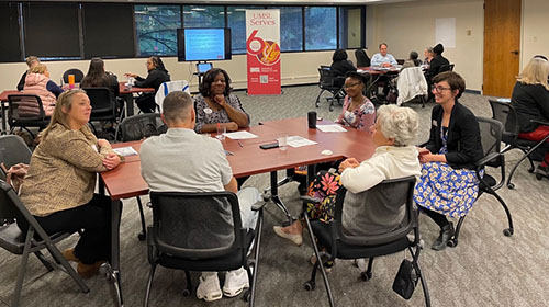 community members sitting around a table