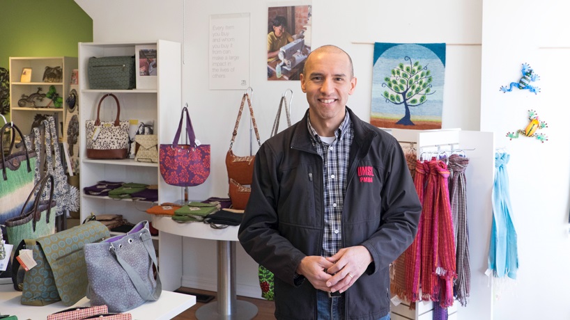 Zegarra stands inside his store along merchandise