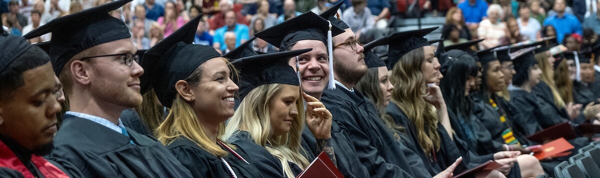 students in robes and mortar boards at commencement 