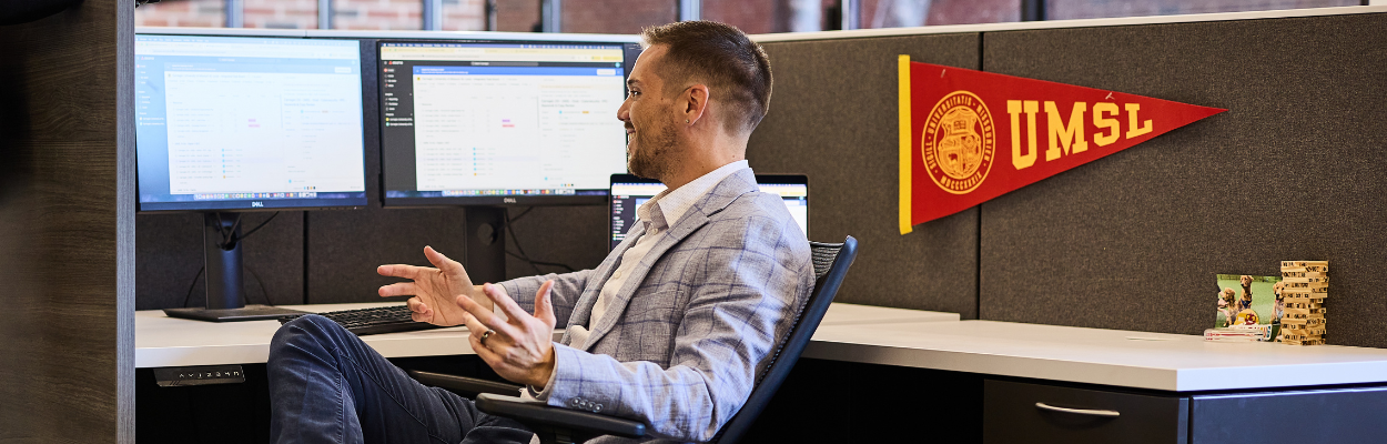 man working at office cubicle