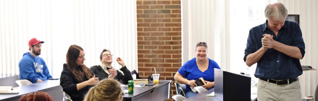 A group of people sitting at a table