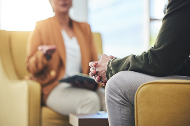 two people talking in a therapy session